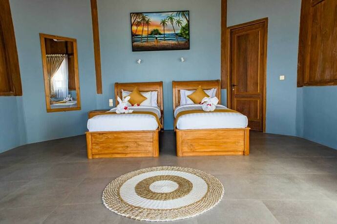 Imagen de la habitación del Hotel Blue Harbor Beachfront Villas and Resto. Foto 17