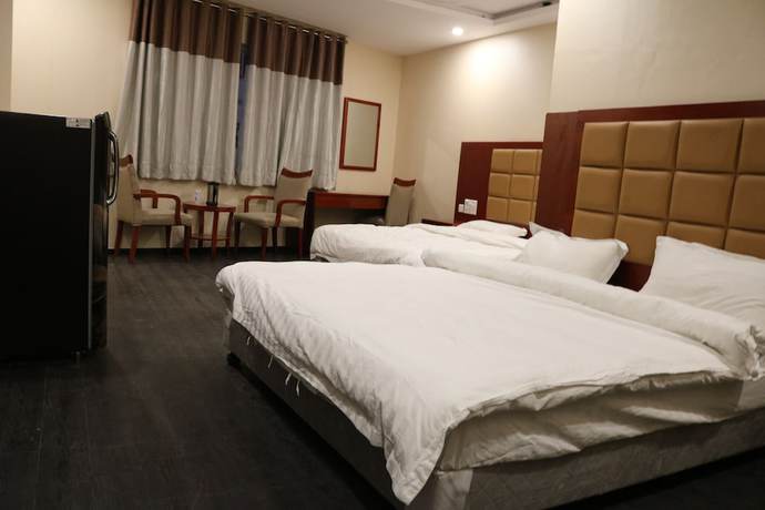 Imagen de la habitación del Hotel Blue Lagoon, Haridwar. Foto 17