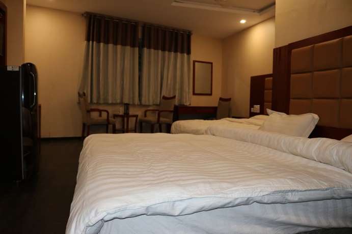 Imagen de la habitación del Hotel Blue Lagoon, Haridwar. Foto 18