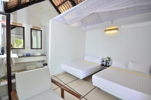 Imagen de la habitación del Hotel Blue Palawan Beach Club. Foto 6