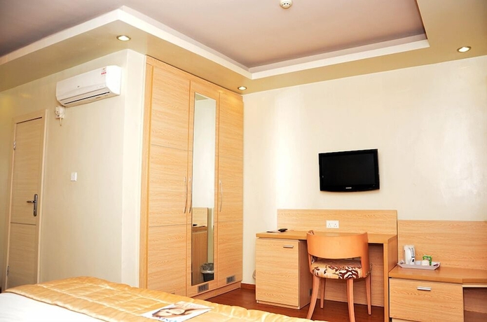 Imagen de la habitación del Hotel Blue Ribbon Suites. Foto 15