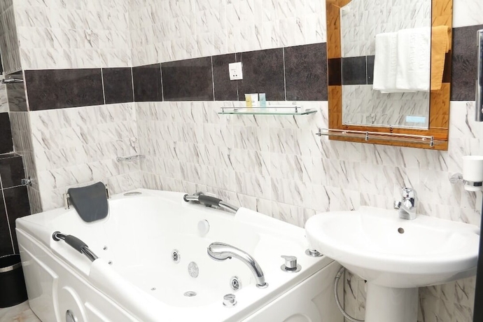 Imagen de la habitación del Hotel Blue Ribbon Suites. Foto 18