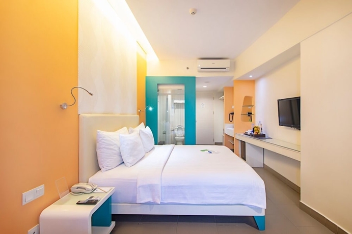 Imagen de la habitación del Hotel Blue Sky Petamburan. Foto 10