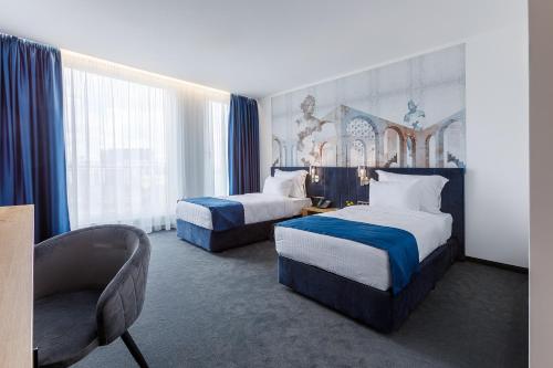 Imagen de la habitación del Hotel Blue Star Luxury. Foto 16