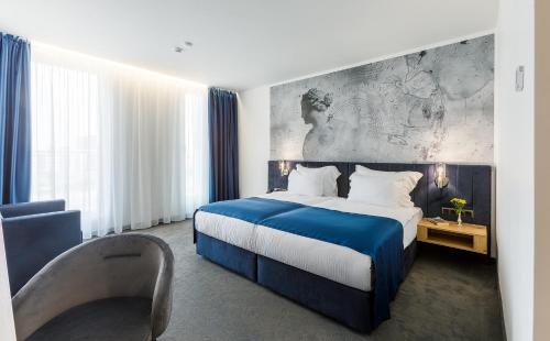 Imagen de la habitación del Hotel Blue Star Luxury. Foto 17