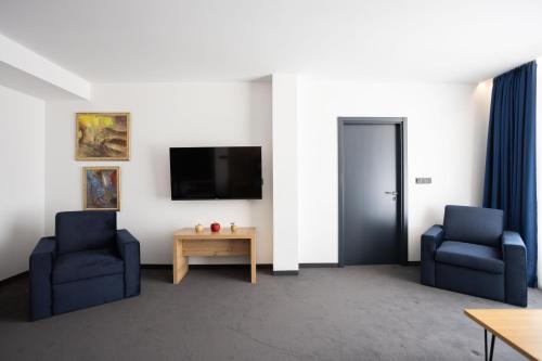 Imagen de la habitación del Hotel Blue Star Luxury. Foto 18
