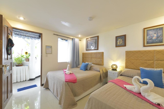 Imagen de la habitación del Hotel Blue Veranda Suites At Boracay. Foto 5
