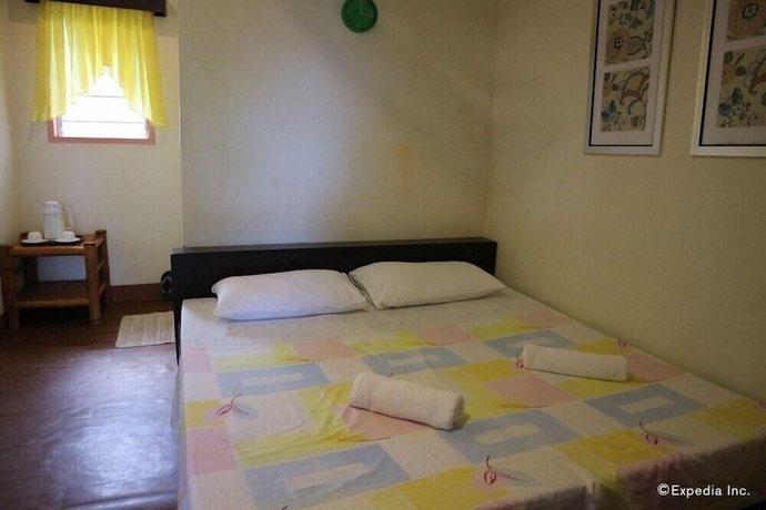 Imagen de la habitación del Hotel Blue Wave Inn Beach Resort and Restaurant. Foto 2
