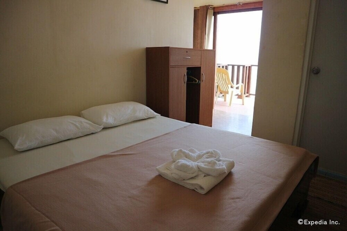 Imagen de la habitación del Hotel Blue Wave Inn Beach Resort and Restaurant. Foto 4
