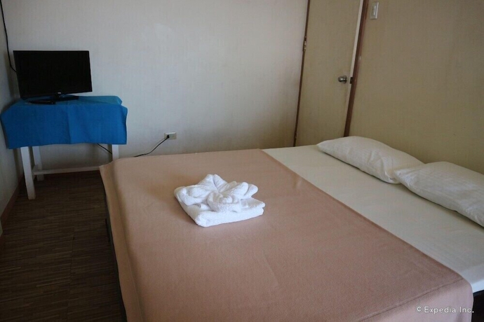 Imagen de la habitación del Hotel Blue Wave Inn Beach Resort and Restaurant. Foto 5