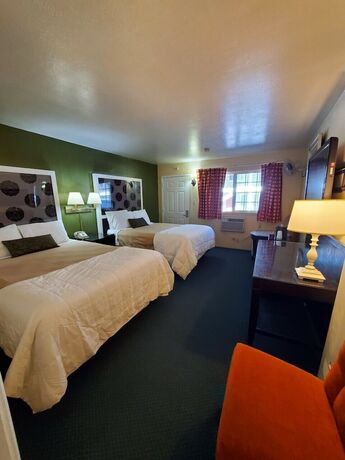 Imagen de la habitación del Hotel Bluebird Day Inn and Suites. Foto 13