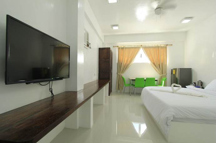 Imagen de la habitación del Hotel Bluewave Hotel. Foto 2