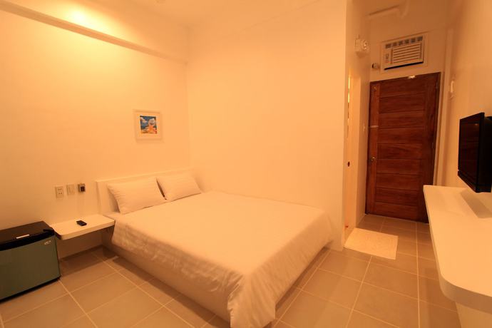 Imagen de la habitación del Hotel Bluewave Hotel. Foto 3