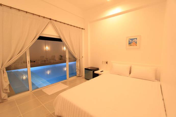 Imagen de la habitación del Hotel Bluewave Hotel. Foto 6