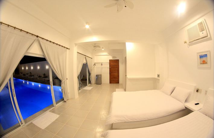 Imagen de la habitación del Hotel Bluewave Hotel. Foto 7