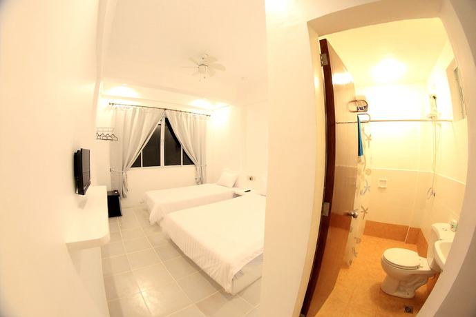 Imagen de la habitación del Hotel Bluewave Hotel. Foto 8