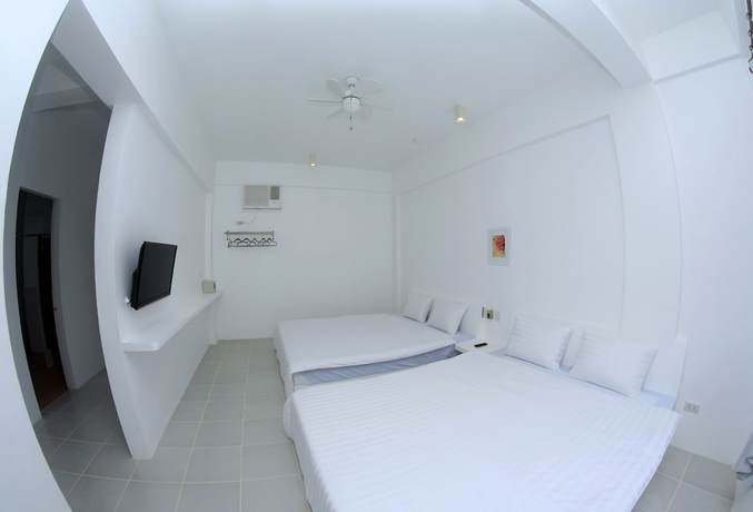 Imagen de la habitación del Hotel Bluewave Hotel. Foto 10