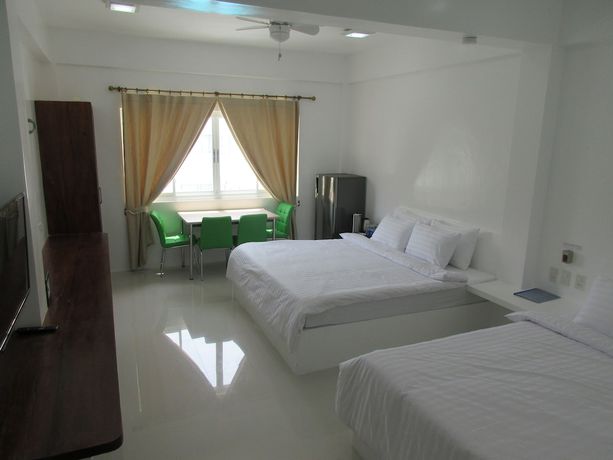 Imagen de la habitación del Hotel Bluewave Hotel. Foto 11