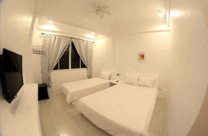 Imagen de la habitación del Hotel Bluewave Hotel. Foto 12