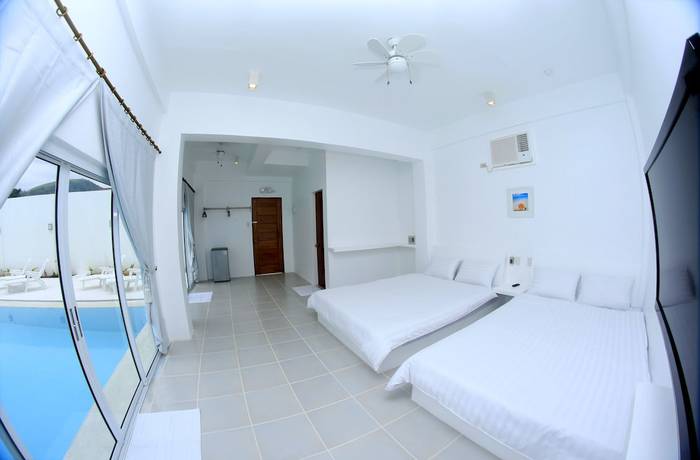 Imagen de la habitación del Hotel Bluewave Hotel. Foto 14