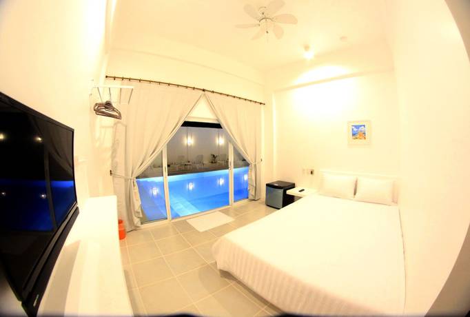 Imagen de la habitación del Hotel Bluewave Hotel. Foto 19