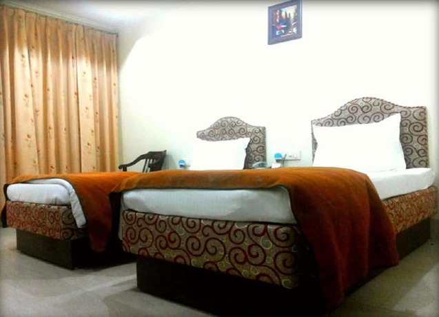 Imagen de la habitación del Hotel Bodhgaya Gautam. Foto 8