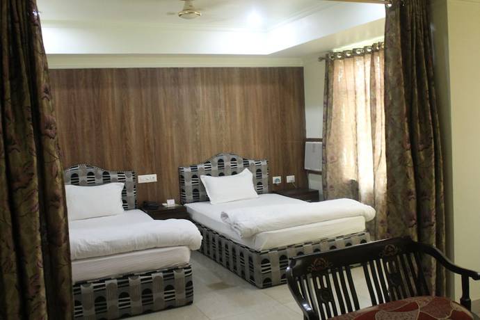Imagen de la habitación del Hotel Bodhgaya Gautam. Foto 10