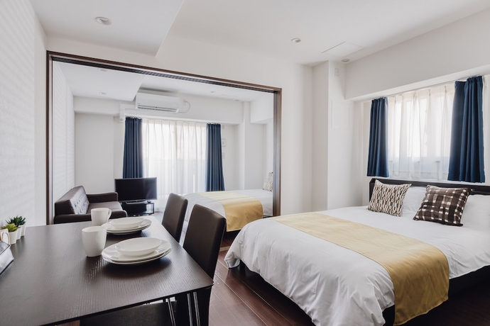 Imagen de la habitación del Hotel Bon Condo Namba Nipponbashi. Foto 3