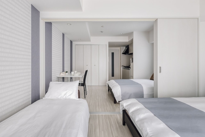 Imagen de la habitación del Hotel Bon Condo Namba Nipponbashi. Foto 8