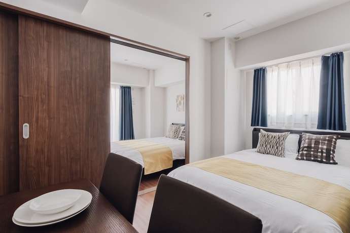 Imagen de la habitación del Hotel Bon Condo Namba Nipponbashi. Foto 11