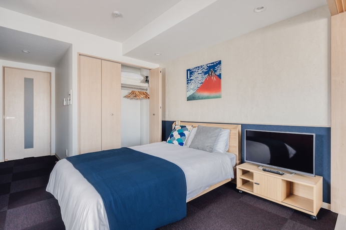 Imagen de la habitación del Hotel Bon Condo Namba Nipponbashi. Foto 14