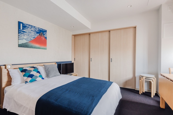 Imagen de la habitación del Hotel Bon Condo Namba Nipponbashi. Foto 17