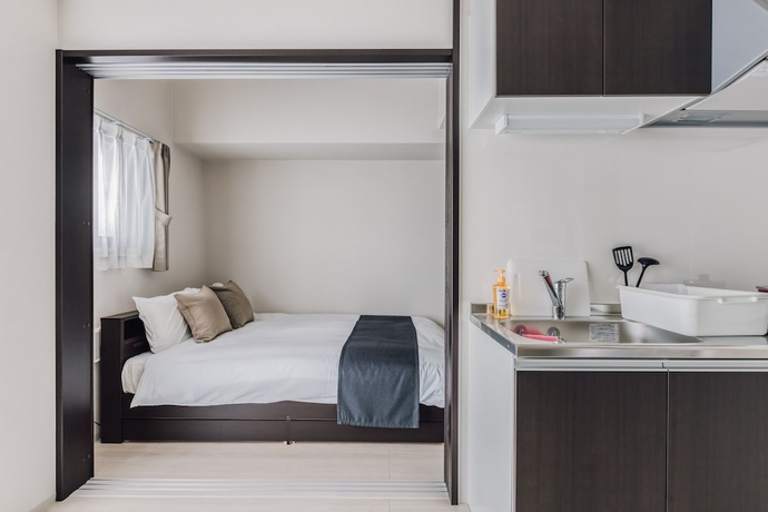 Imagen de la habitación del Hotel Bon Condominium Umeda. Foto 16