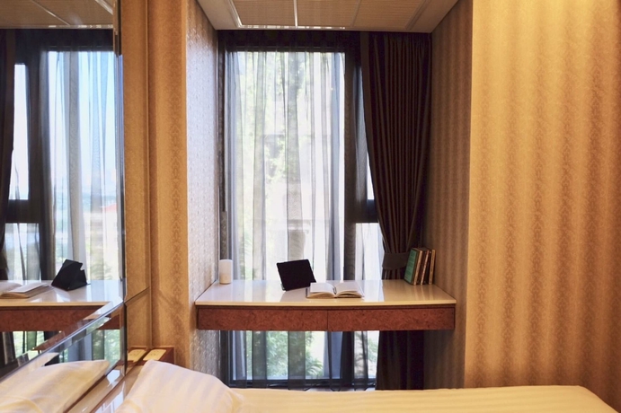 Imagen de la habitación del Hotel Boonrumpa Condotel. Foto 4