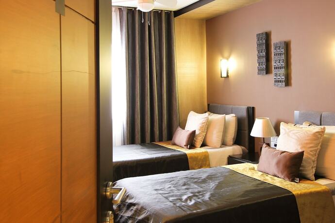 Imagen de la habitación del Hotel Boracay Suites. Foto 16