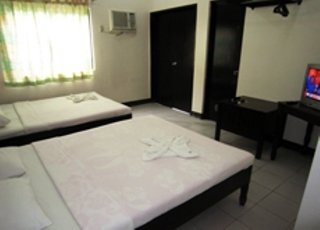 Imagen de la habitación del Hotel Boracay Travelodge Beach Resort. Foto 7