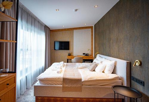 Imagen de la habitación del Hotel Bordűr Wellness Superior &eacute;s Szőnyegm&uacute;zeum. Foto 13