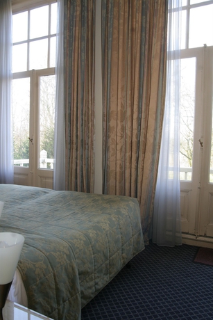 Imagen de la habitación del Hotel Borgmann Villa Hotel. Foto 13