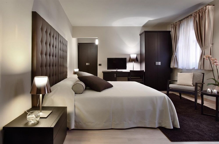 Imagen de la habitación del Hotel Borgo Dei Conti Resort Relais and Chateaux. Foto 3