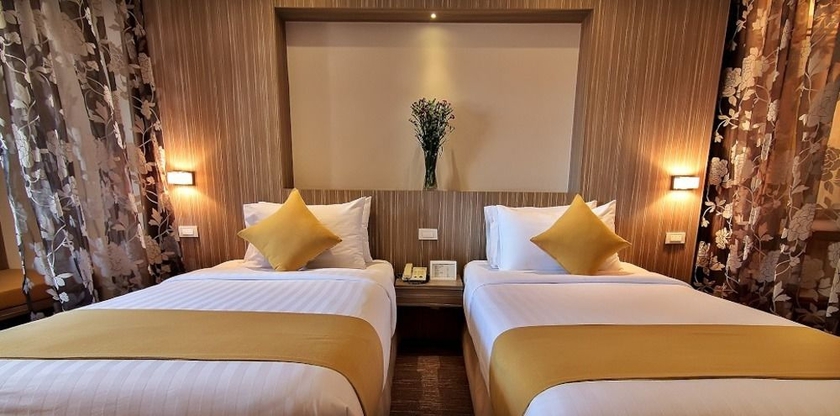 Imagen de la habitación del Hotel Bossotel Bangkok. Foto 4