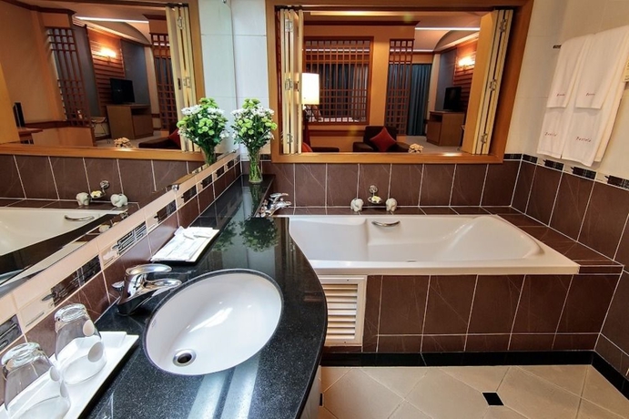 Imagen de la habitación del Hotel Bossotel Bangkok. Foto 8