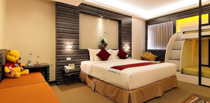 Imagen de la habitación del Hotel Bossotel Bangkok. Foto 11