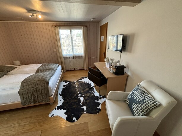 Imagen de la habitación del Hotel Boutique Alpina. Foto 18