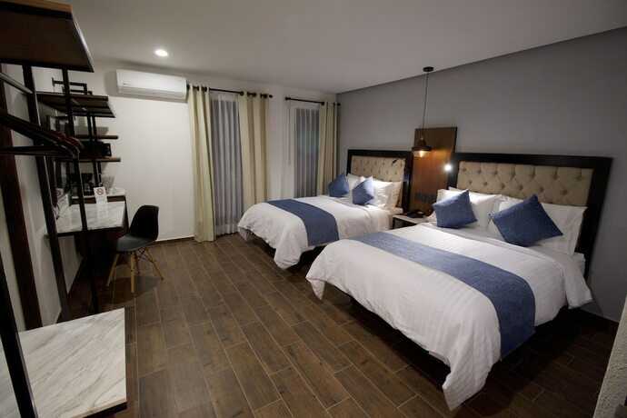 Imagen de la habitación del Hotel Boutique Casa Loreta. Foto 16