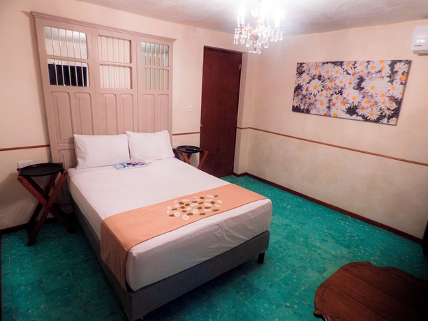 Imagen de la habitación del Hotel Boutique Flores y Gemas. Foto 6