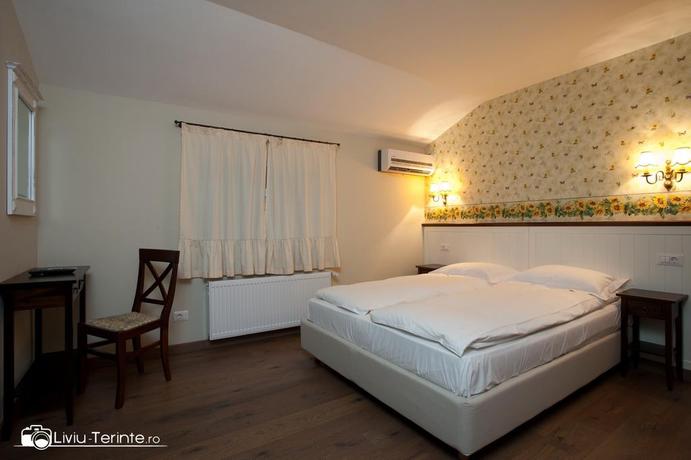 Imagen de la habitación del Hotel Boutique Hotel Piazzetta. Foto 11