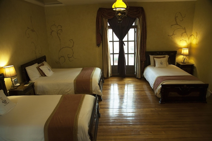 Imagen de la habitación del Hotel Boutique Los Balcones. Foto 14