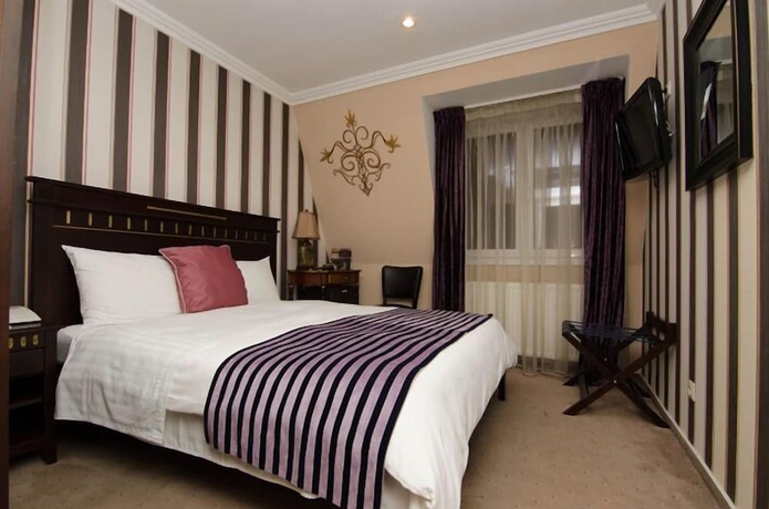 Imagen de la habitación del Hotel Boutique Monaco. Foto 6