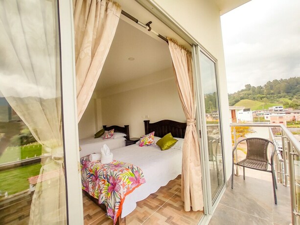 Imagen de la habitación del Hotel Boutique Palmas De Salento. Foto 13