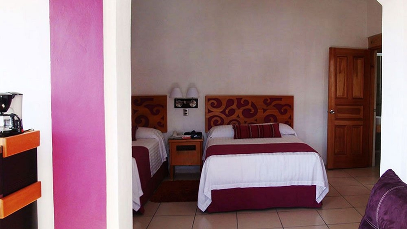 Imagen de la habitación del Hotel Boutique Pueblo Lindo. Foto 8